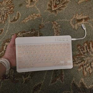 Bluetooth Keuboard For Cell Phones Or Tablets Comes With USB Cord Pink And White